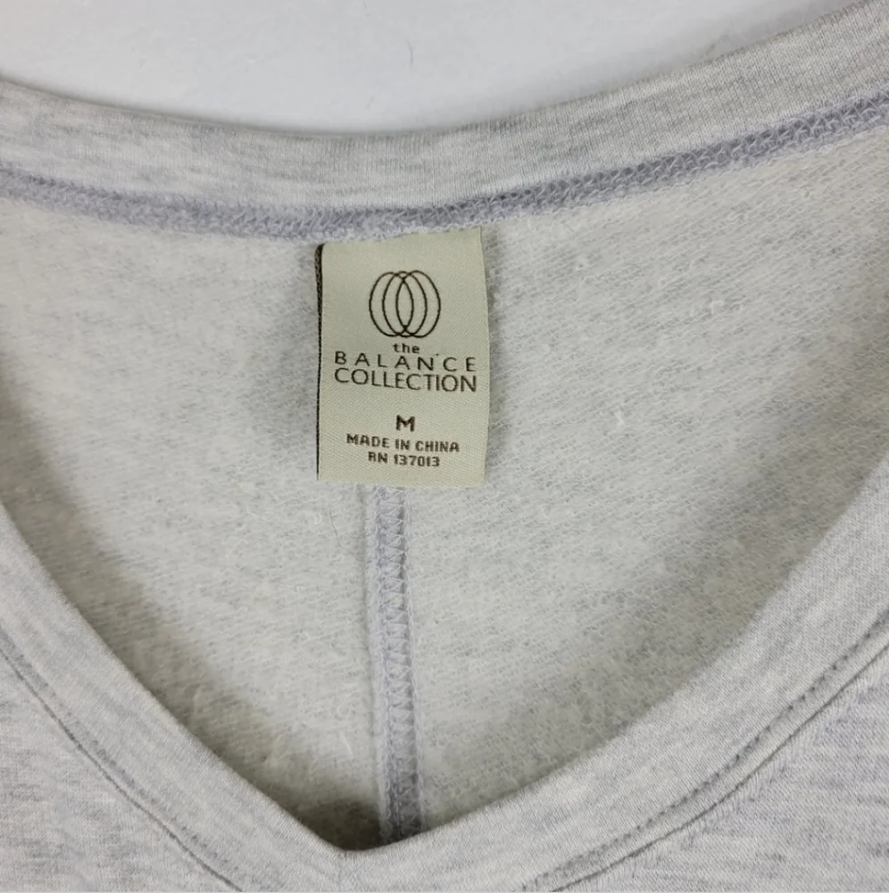 New Balance Collection Long Sleeve V Neck Sheer Side Panel pullover Sweater